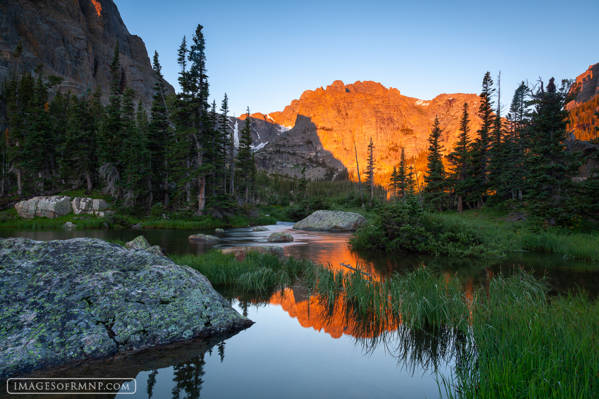 In late summer Taylor Peak and the Cathedral glow brightly in the early morning light. As this new day begins birds sing above...