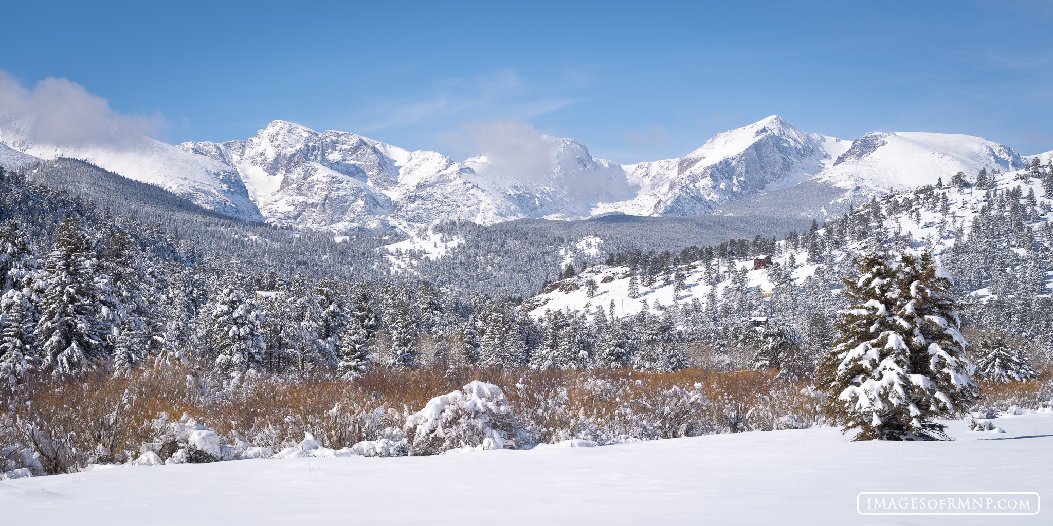 The peaks of the Continental Divide wear a fresh white coat of snow following a March snowstorm. At this time of year the willows...