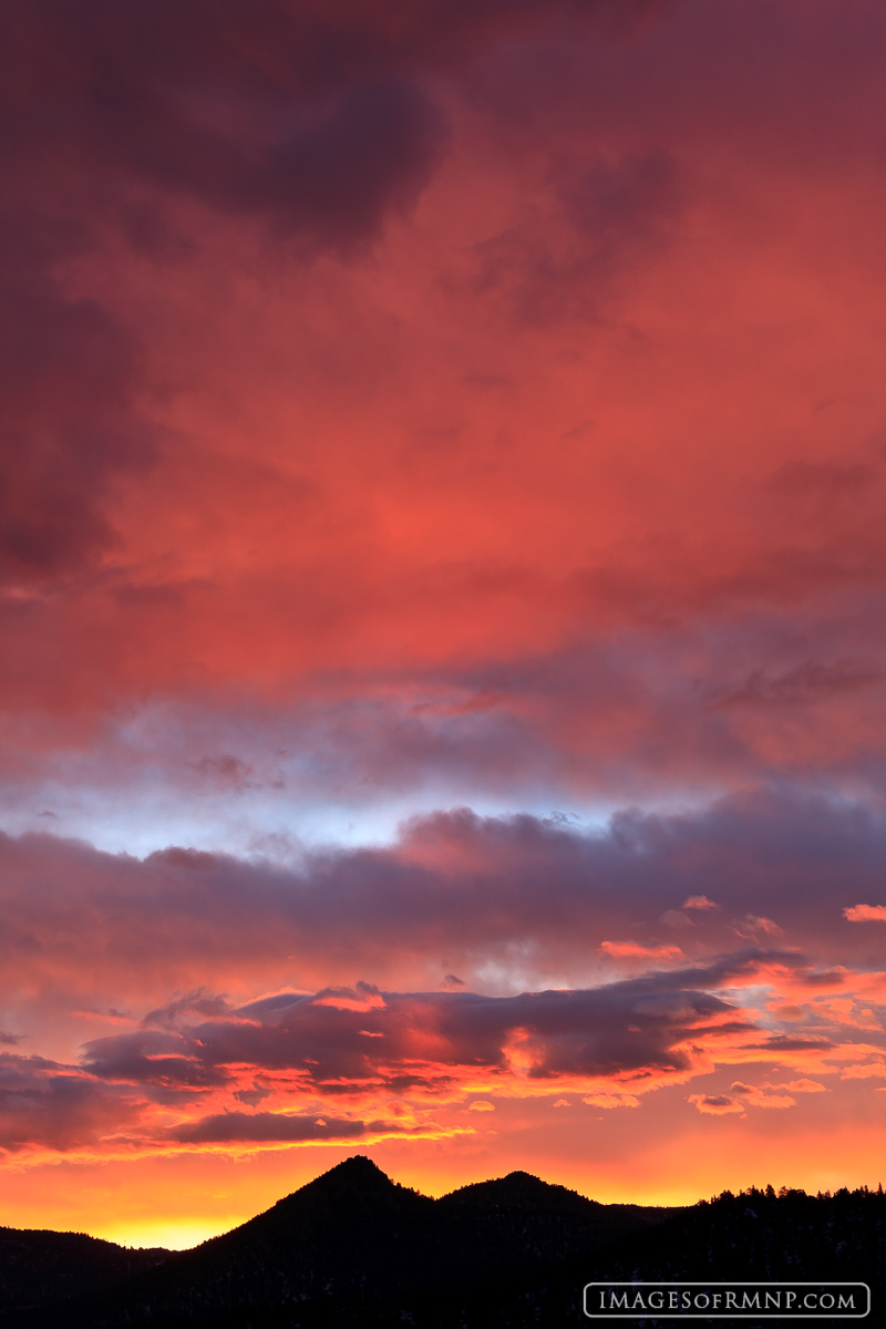 A February sunrise fills the clouds with color just east of Estes Park.