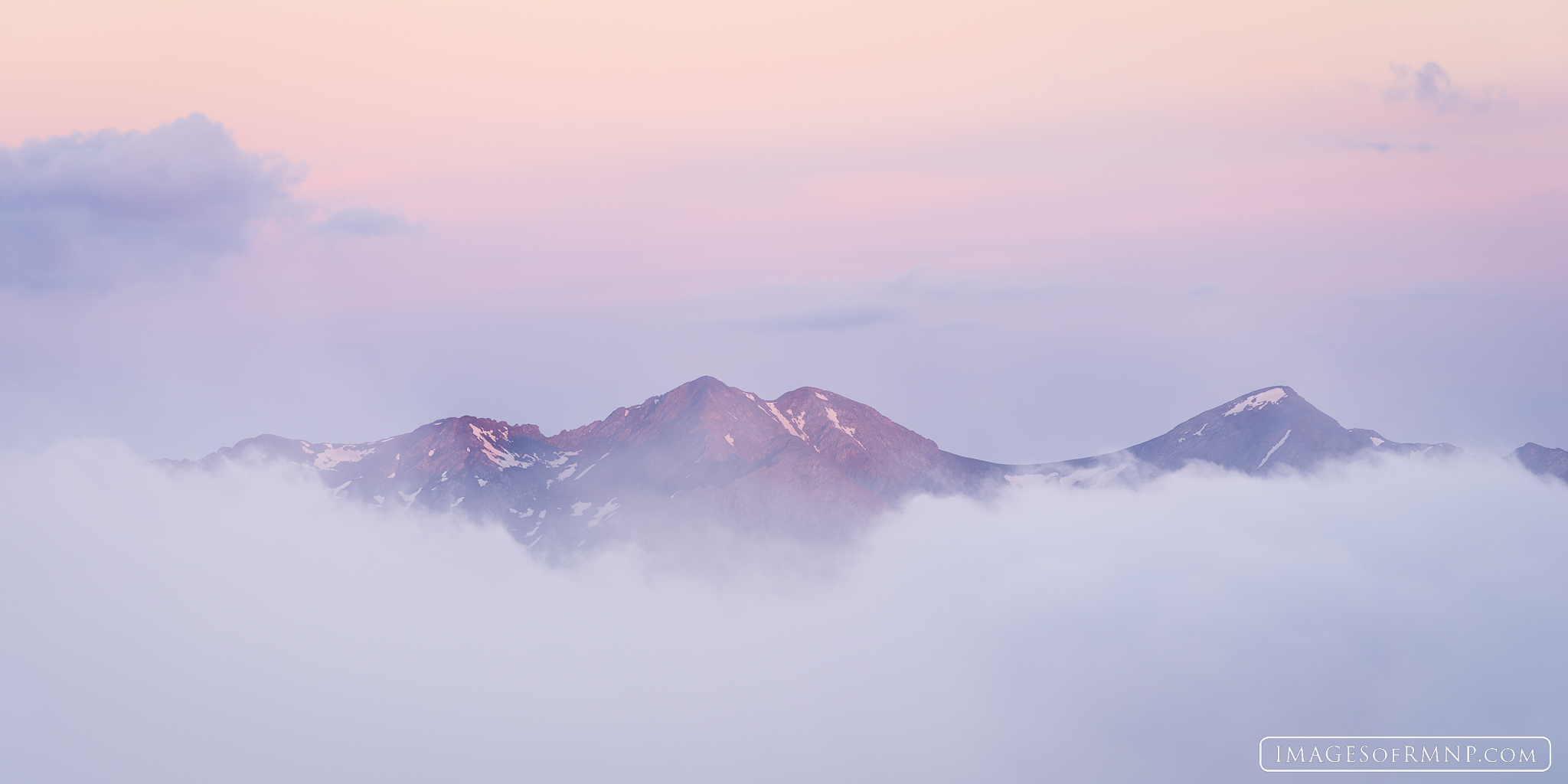 Howard Mountain floats above the clouds at dawn as seen from the Gore Range Overlook  on Trail Ridge Road in Rocky Mountain National...