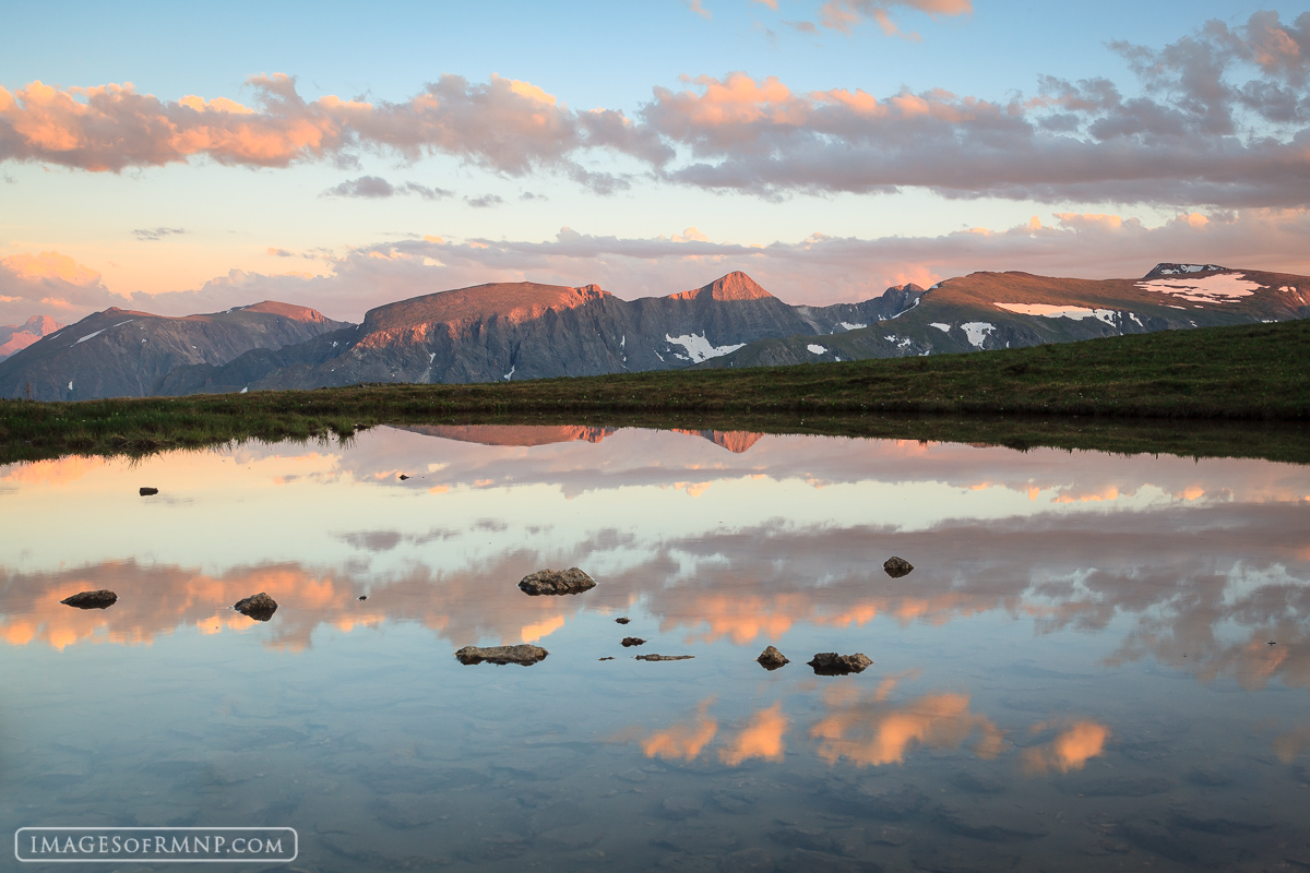 On this night as I stood by the edge of this small alpine tarn listening to the birds chirp and watching the setting sun light...
