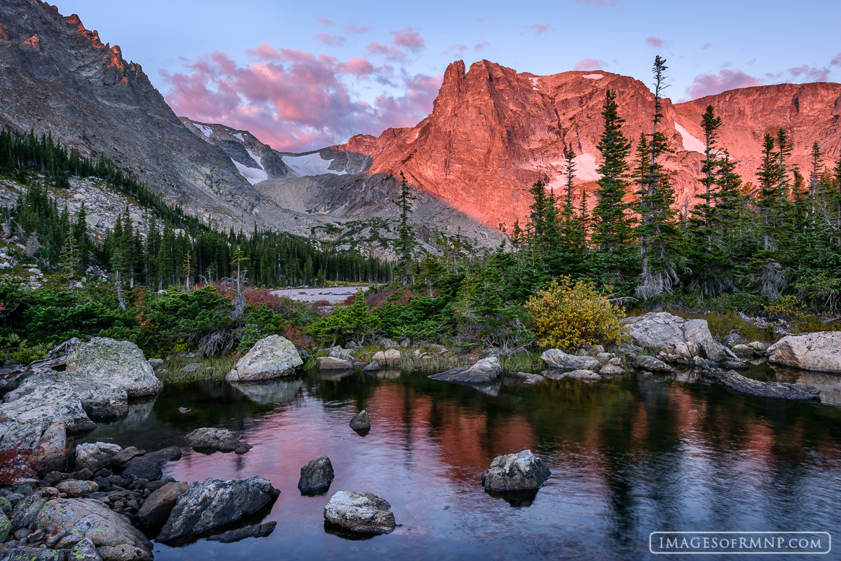 Notchtop Mountain awakens to a fresh new autumn morning as the birds below start to sing and the foliage begins dressing in its...