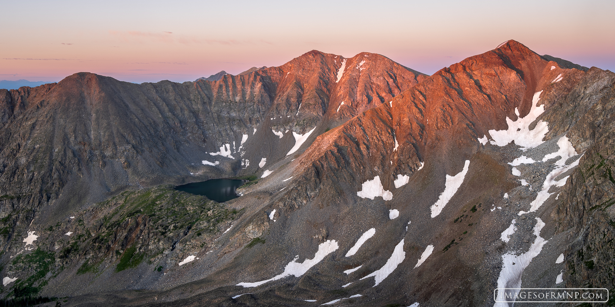 Howard Mountain and Mount Cirrus bathe in the warm light of sunrise on a beautiful summer morning in Rocky Mountain National...