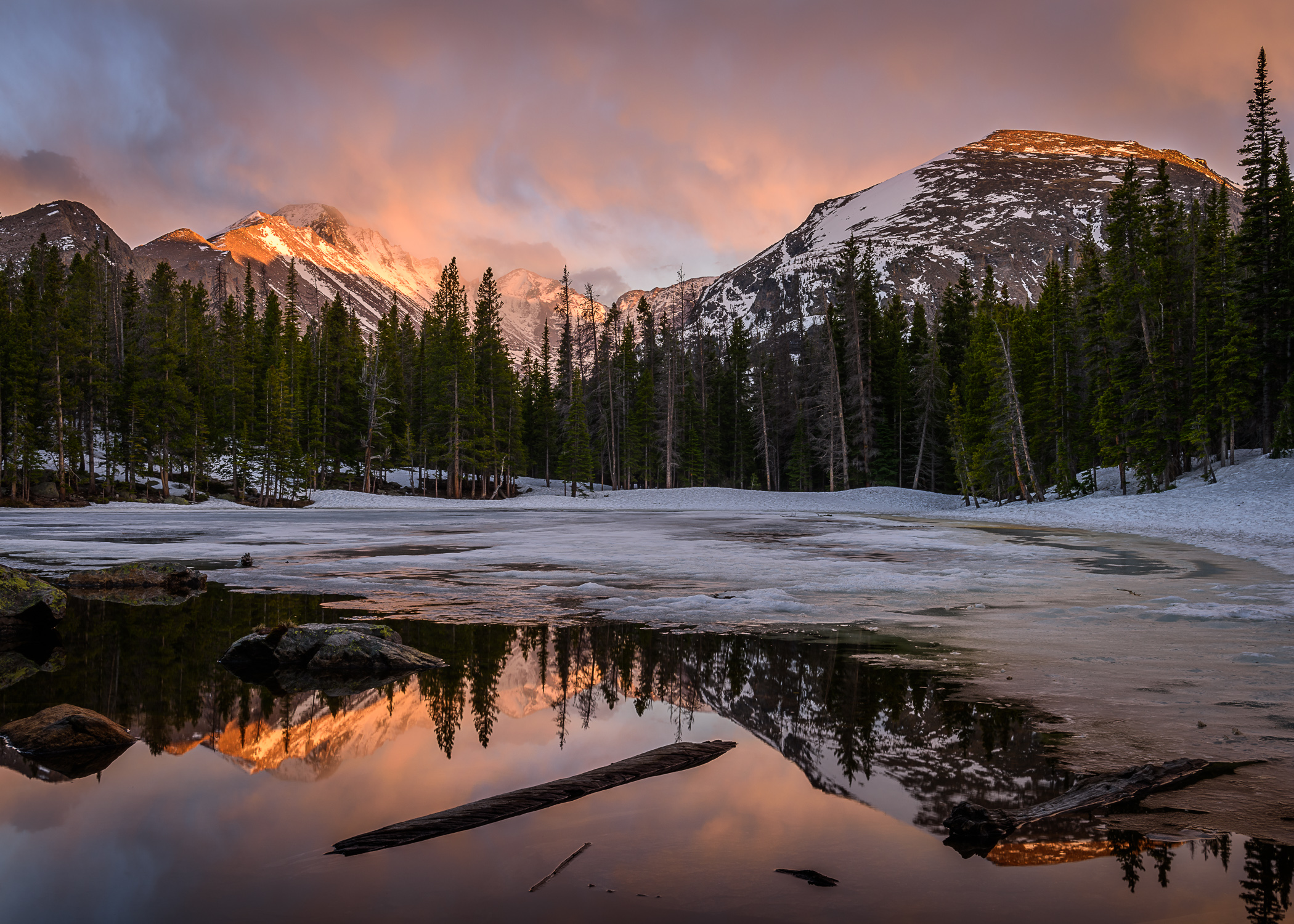 On this May evening as Nymph Lake was in the middle of its transition from winter to summer, the sky and peaks above exploded...