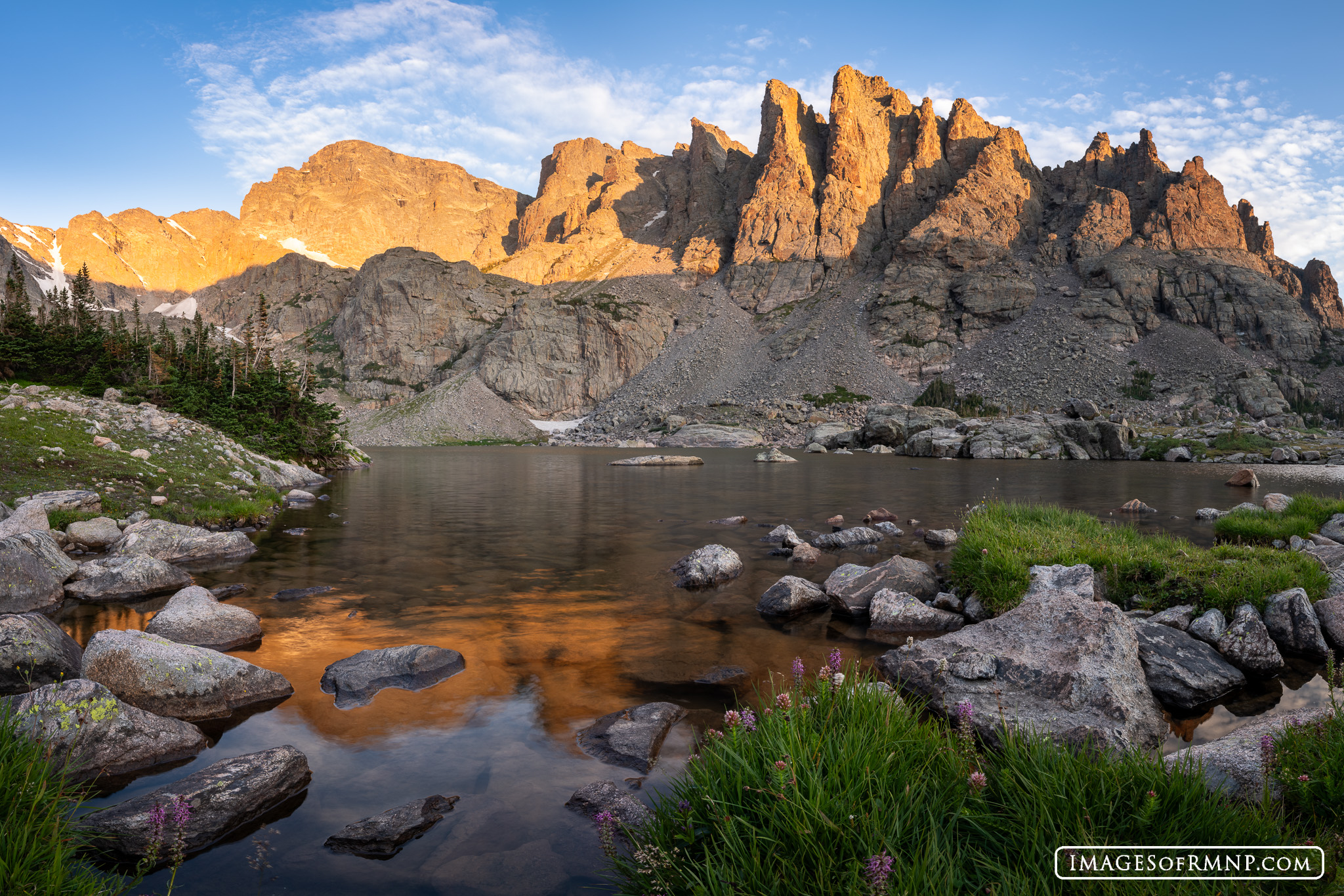 The Cathedral Spires above Sky Pond seem to reach for the sky as if celebrating this glorious summer morning.