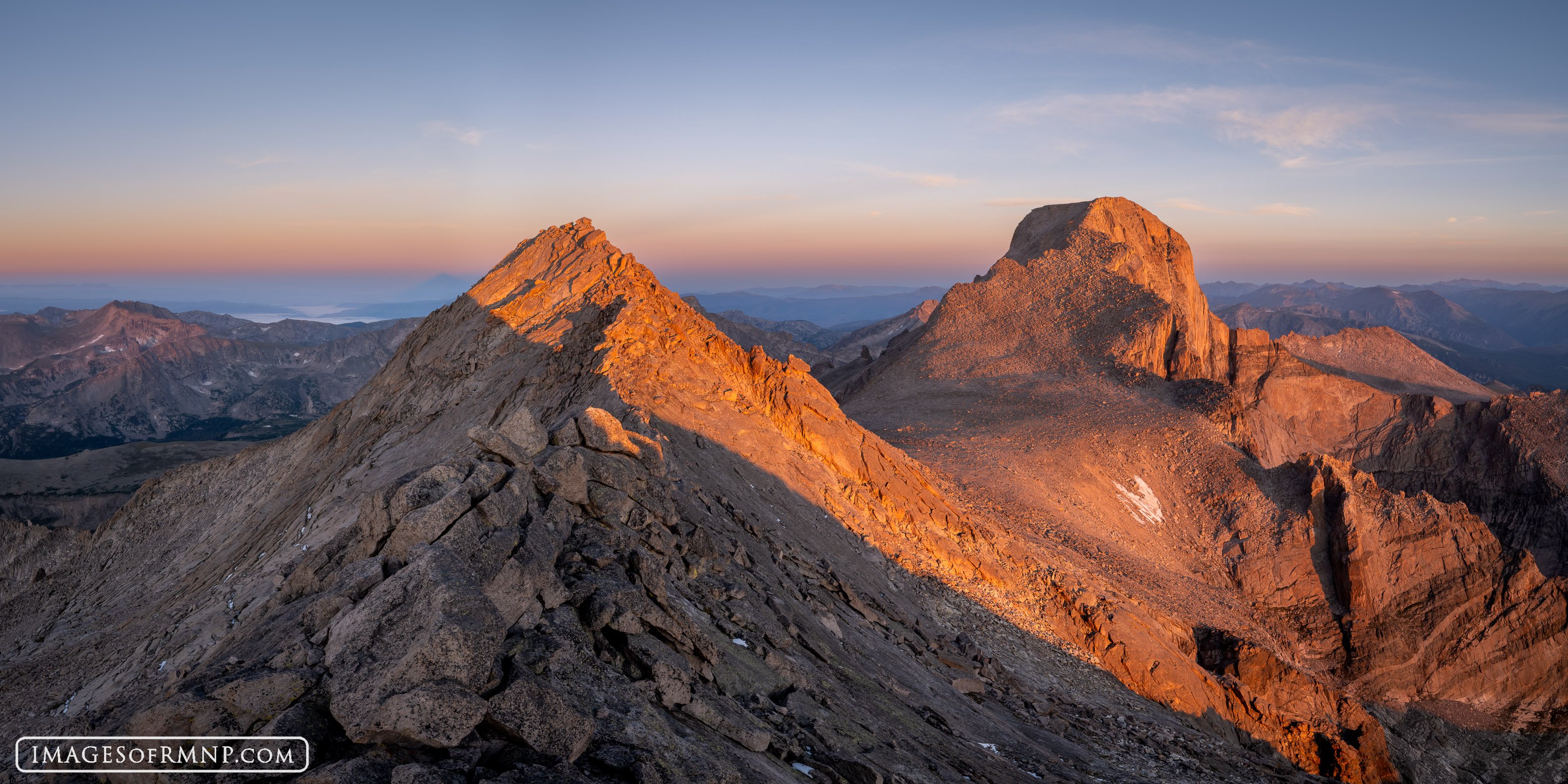 The rocky summits of Mount Meeker and Longs Peak glow in the first light of a new day. These are the two tallest mountains in...