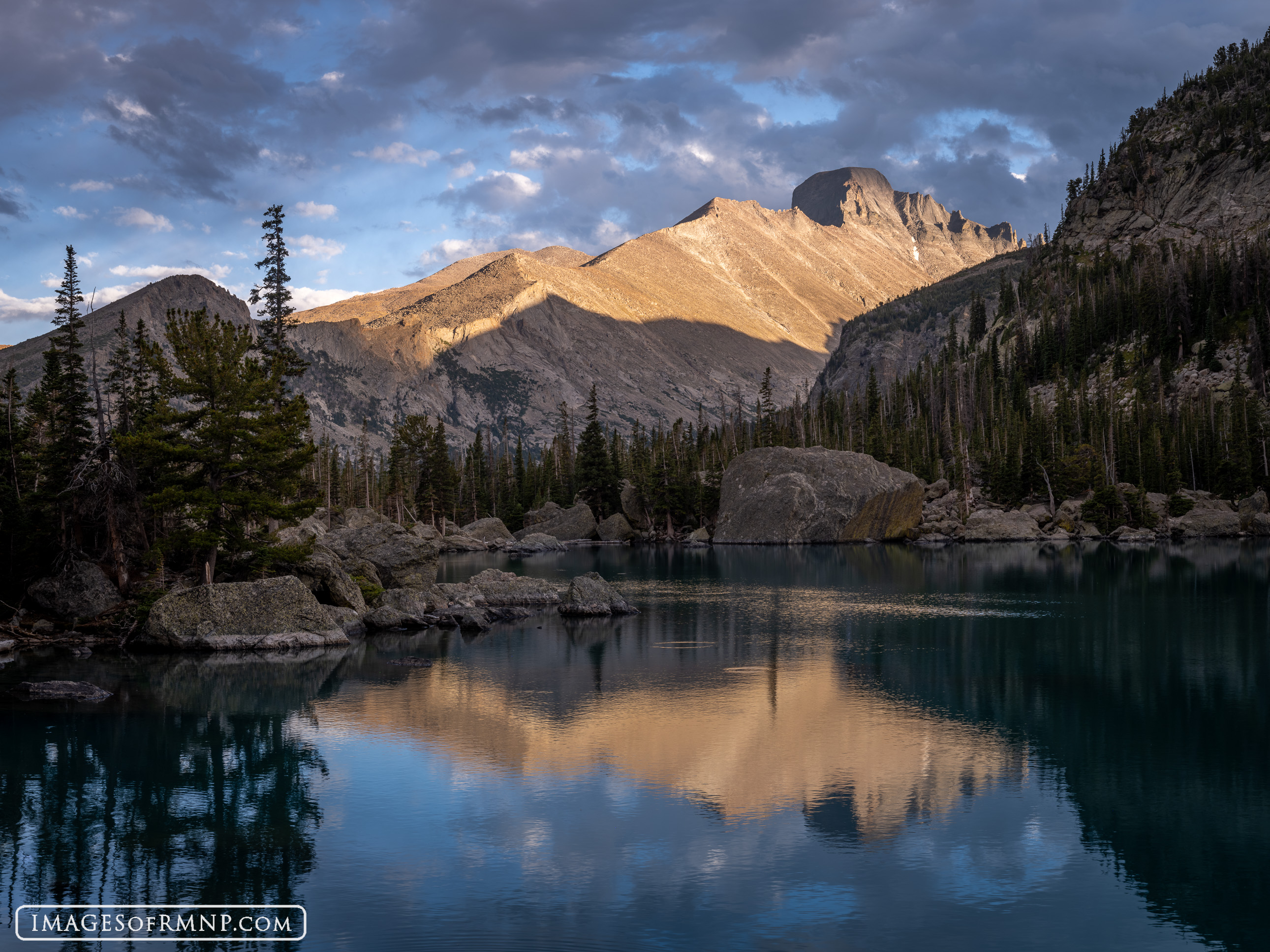 Towering above Lake Haiyaha, Longs Peak with its blocky summit catches the last light of the day. Nearly everywhere in the park...